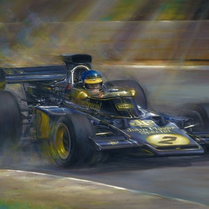 May include: A painting of a black and gold Formula 1 race car, with the words "John Player Special" visible. The car is speeding around a track, with the driver wearing a blue helmet. The number 2 is on the car.