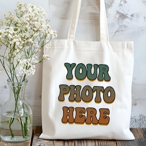 Custom canvas tote bag with your logo printed on durable, eco-friendly 100% cotton canvas in natural color. Perfect for bulk business gifts, branded promotional swag, trade show giveaways, or custom packaging for small shops. Reusable and lightweight with sturdy self-fabric handles, ideal for companies, events, or sustainable marketing campaigns. Great for custom printing, logo branding, or corporate gifting