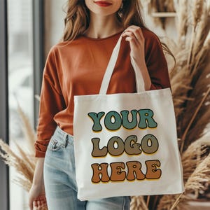 Personalized bridesmaid tote bag made from natural cotton canvas, customized with a name or short message in elegant script font. A perfect reusable gift for bachelorette parties, wedding day accessories, or birthday gifts for her. Lightweight yet durable with spacious design and aesthetic appeal. Great for bridal party proposals, weekend wedding bags, or thoughtful custom gifts with a personal touch