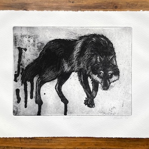 May include: Black and white etching of a wolf with a dripping effect. The wolf is facing forward with its head slightly tilted down. The etching is signed "Wolf" and "C. Smith 14".
