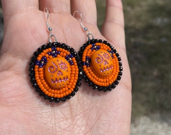 Orange Sugar Skull Earrings. Cute Skull earrings to wear for a Halloween accessory or Day of the Dead earrings