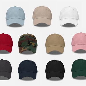 May include: A set of 10 blank baseball caps in various colors, including light blue, beige, white, red, camouflage, khaki, pink, dark gray, navy blue, and dark green.