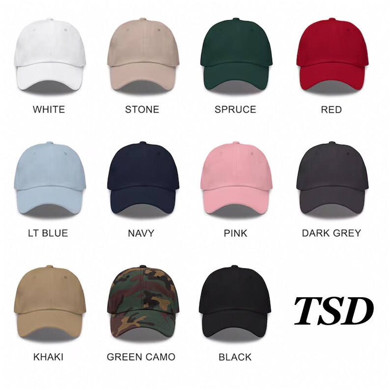 May include: Twelve different color baseball caps, including white, stone, spruce, red, light blue, navy, pink, dark grey, khaki, green camo, and black. The caps are arranged in a grid pattern on a white background. The word "TSD" is in the bottom right corner of the image.