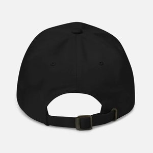 May include: Black baseball cap with an adjustable strap in the back.