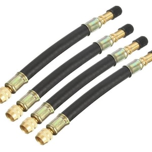 May include: Four black flexible air chuck hoses with brass fittings and black valve caps. These hoses are designed for inflating tires and other pneumatic applications. The hoses are arranged diagonally against a white background.