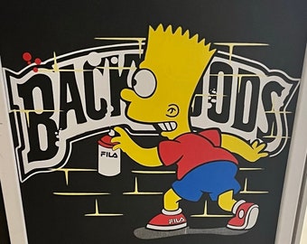May include: A black graphic print featuring a yellow cartoon character wearing a red shirt and blue shorts, holding a white spray paint can labeled FILA. The character stands before large white text reading BACKWOODS with a black outline.