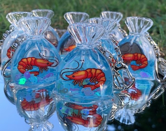 Adotta un gambero — Ciondolo a forma di gambero in sacchetto di plastica con agitatore liquido