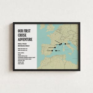 May include: A framed map print titled Our First Cruise Adventure, featuring a light blue sea and beige landmasses. It displays a Mediterranean cruise route with black dots marking Palma, Barcelona, Toulon, Villefranche, and Livorno.