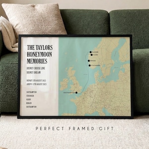 May include: A framed map print detailing a cruise route from Southampton to Norway, labelled "THE TAYLORS HONEYMOON MEMORIES". The print includes the text "DISNEY CRUISE LINE DISNEY DREAM" and dates. The words "PERFECT FRAMED GIFT" are at the bottom.