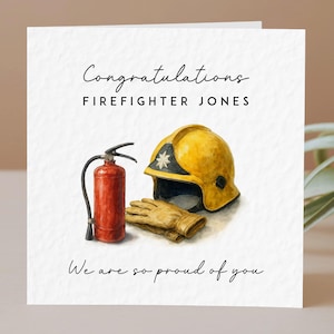 May include: A square greeting card with a white textured background featuring a watercolour illustration of a red fire extinguisher, a yellow firefighter helmet, and tan gloves. The text reads: Congratulations FIREFIGHTER JONES We are so proud of you.