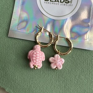 Mix and match charms. Flower and turtle made of ceramic.