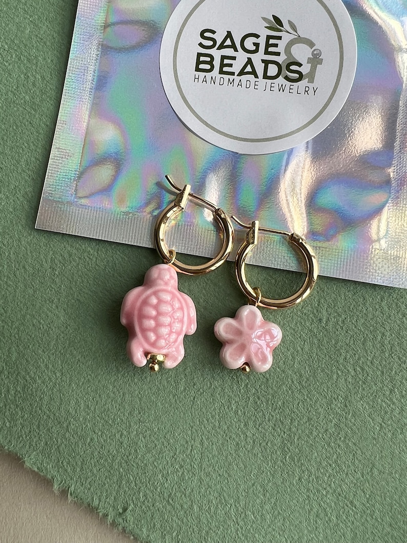 Mix and match charms. Flower and turtle made of ceramic.