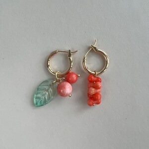 Coral stick and cherry charm