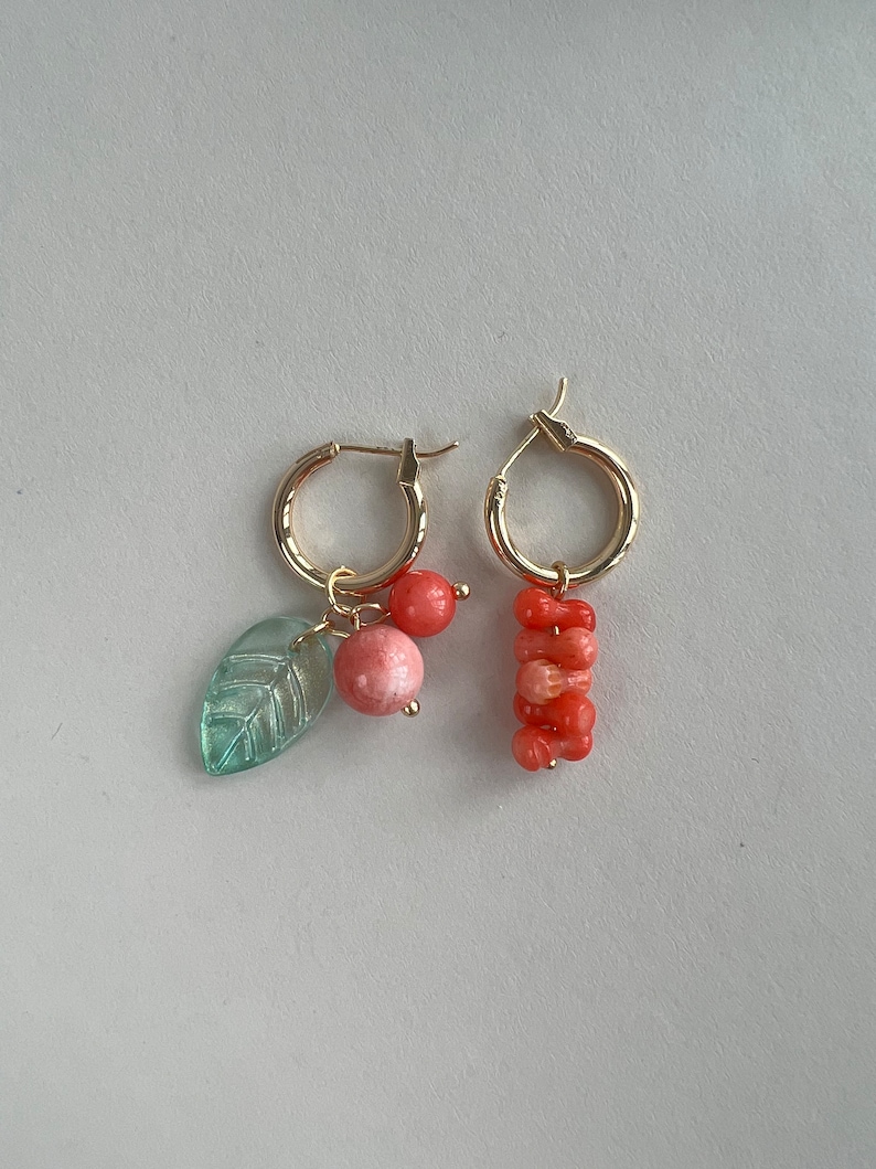 Coral stick and cherry charm