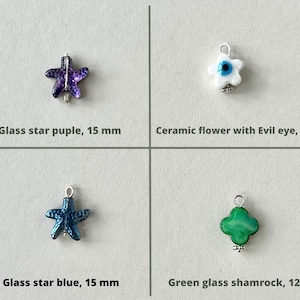 Charm has gold plated or silver plated finishing.