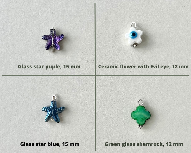 Charm has gold plated or silver plated finishing.