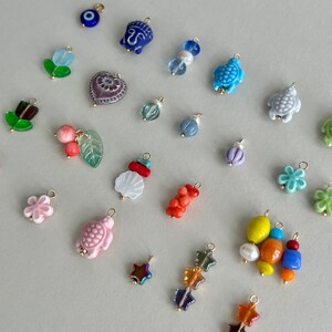 All  charms are coming with 5 mm connection ring. Please let me know if you need smaller/bigger ring.