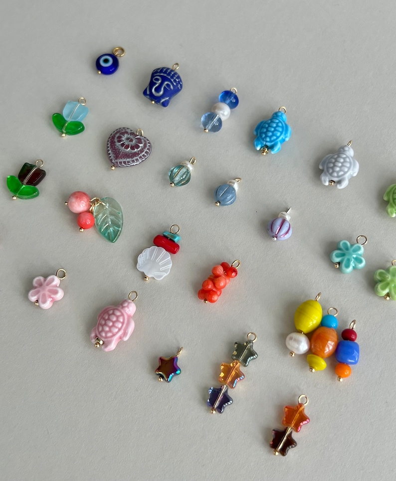 All  charms are coming with 5 mm connection ring. Please let me know if you need smaller/bigger ring.