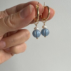 Glass ball with small pearl. All charms coming with 5mm connection ring. Please let me  know if you need smaller or bigger ring.