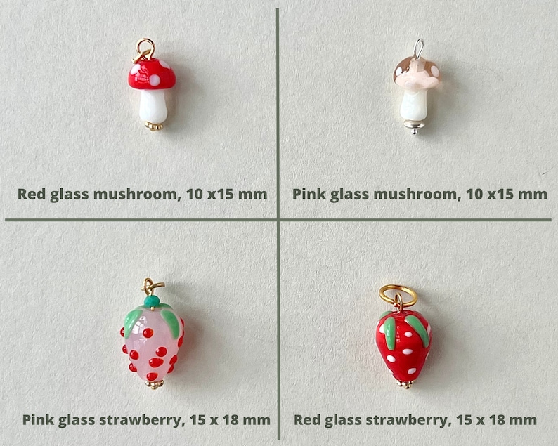 Handmade  lamp work mushroom and strawberry charms.