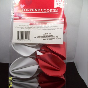 May include: A package of 10 red and white fortune cookies. The package is labeled "Fortune Cookies" and includes 10 fortunes. The package is made in China and distributed by Greenbrier International, Inc.