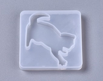 Op de afbeelding: Transparante siliconen mal voor het gieten van hars, met een hondensilhouet. De mal is vierkant en heeft een glad oppervlak.