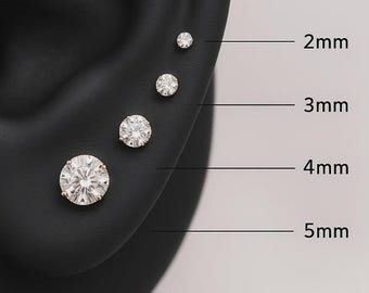 May include: Four round, clear, faceted stud earrings arranged in a vertical line on a black ear model. The earrings are labeled with their respective diameters: 2mm, 3mm, 4mm, and 5mm, indicating the size of each individual stone in the set.