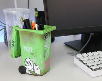 Graffitied recycling / trash bin pencil holder