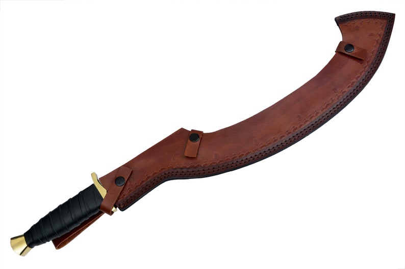 May include: A brown leather scabbard with a curved blade and a gold-colored handle. The scabbard has decorative stitching and a snap closure.