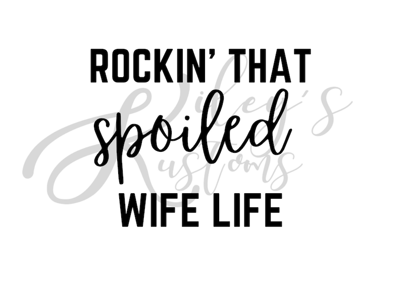 May include: Black and white text graphic that reads "Rockin' That Spoiled Wife Life".