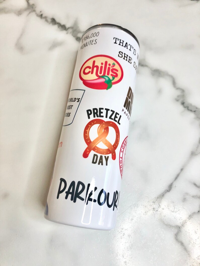 May include: White tumbler with various colorful logos and text, including "chili's", "Pretzel Day", "That's What She Said", and "Parkour".