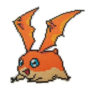 May include: Cross-stitch pattern of an orange and white cartoon character with large ears and wings. The character has blue eyes and a pink tongue.