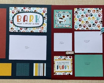 May include: A scrapbook layout with a blue and red background. The layout features a variety of paper scraps, including paw prints, stripes, and polka dots. The layout also includes a variety of embellishments, including a dog bone, a dog house, and a puppy.