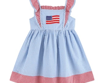 Blauwe jurk met ruches en ruitjespatroon in de vorm van de Amerikaanse vlag