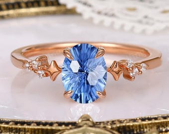 Bague de promesse de mariage de mariage étoile céleste et lune en or rose saphir coupe feu d'artifice bleu sept.