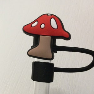 May include: A red and white mushroom shaped silicone bottle stopper with a black strap.