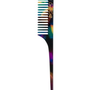 May include: A colorful comb with a long, pointed handle. The comb's teeth are black, and the handle features a marbled pattern of purple, blue, green, and yellow. The text "Coisa de Calla" is printed in gold on the handle.