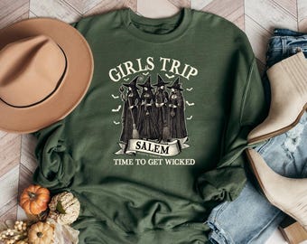 May include: Green sweatshirt with a graphic of three witches and the text "Girls Trip Salem Time to Get Wicked".