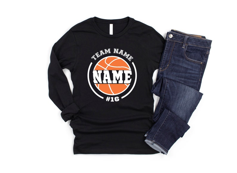 May include: Black long-sleeve shirt with a basketball graphic and the text "TEAM NAME NAME #16".