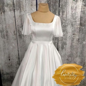 Elegante satijnen trouwjurk, lange trouwjurk, ivoor trouwjurk, a-lijn trouwjurk, satijnen trouwjurk met korte mouwen, bruidsjurk