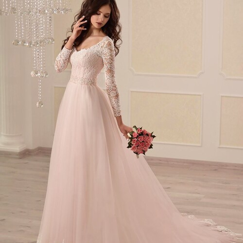 light pink long sleeve gown