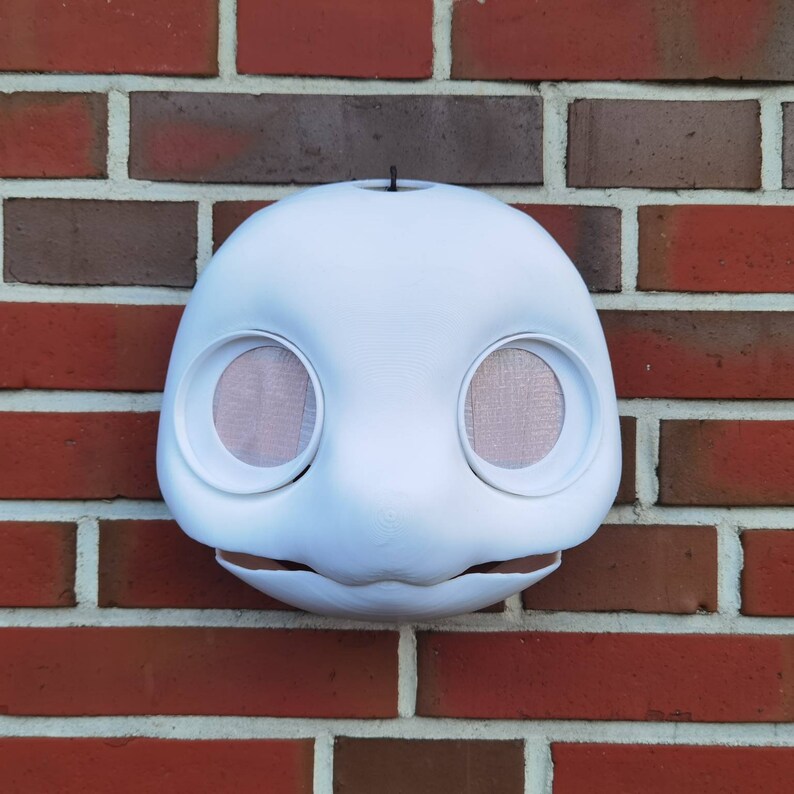 May include: White unpainted animal mask with large eye holes and a small mouth opening. The mask is made of a smooth, hard material and is ready for painting.