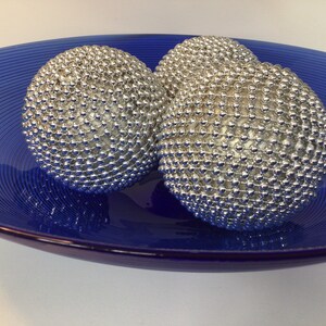 Silver beaded home decor ball in 3 sizes
Bowl or basket fillers 
Table centrepiece 
Christmas decorations