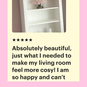 May include: White bookshelf with four shelves, decorated with a pink flower arrangement, a string of lights with pink and yellow balls, and other decorative items. The text "Perfect in Pink!!!" is written below the image.