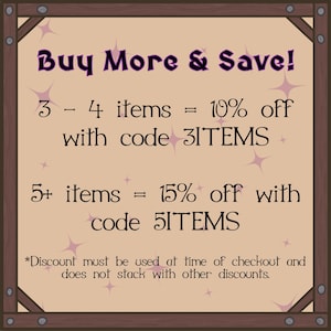 May include: A framed sign with the text "Buy More & Save!" in purple script. It offers discounts: 10% off 3-4 items with code 3ITEMS, and 15% off 5+ items with code 5ITEMS. The sign is tan with star accents.