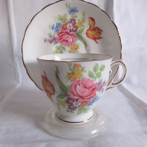 Tuscan White Cup and Saucer,  flower design, gilt trim 1950s