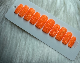 Neonoranje druk op de nagels