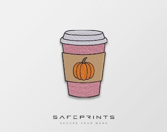 May include: Pink and brown embroidered patch of a coffee cup with a pumpkin on the side. The text "SAFEPRINTS SECURE YOUR MARK" is below the image.