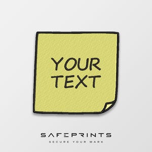 May include: A yellow embroidered patch with the words "YOUR TEXT" in black, outlined in black. The patch has a black border and a curled corner. The logo "SAFEPRINTS SECURE YOUR MARK" is at the bottom.