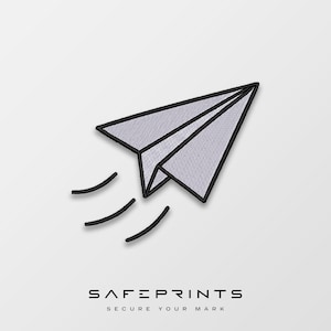 May include: A gray paper airplane patch with black outline and three curved lines indicating motion. The text "SAFEPRINTS SECURE YOUR MARK" is at the bottom of the image.
